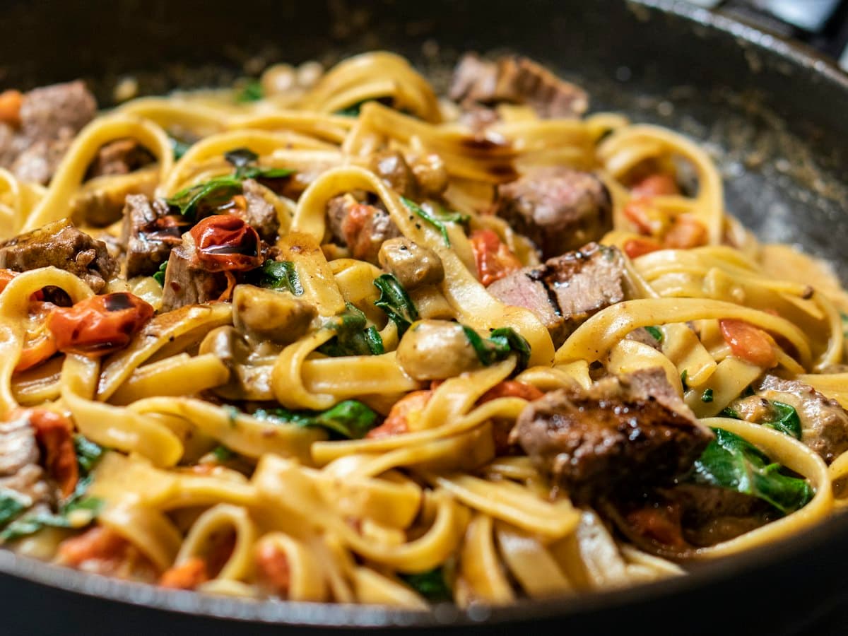 Fresh tagliatelle finished in the pan